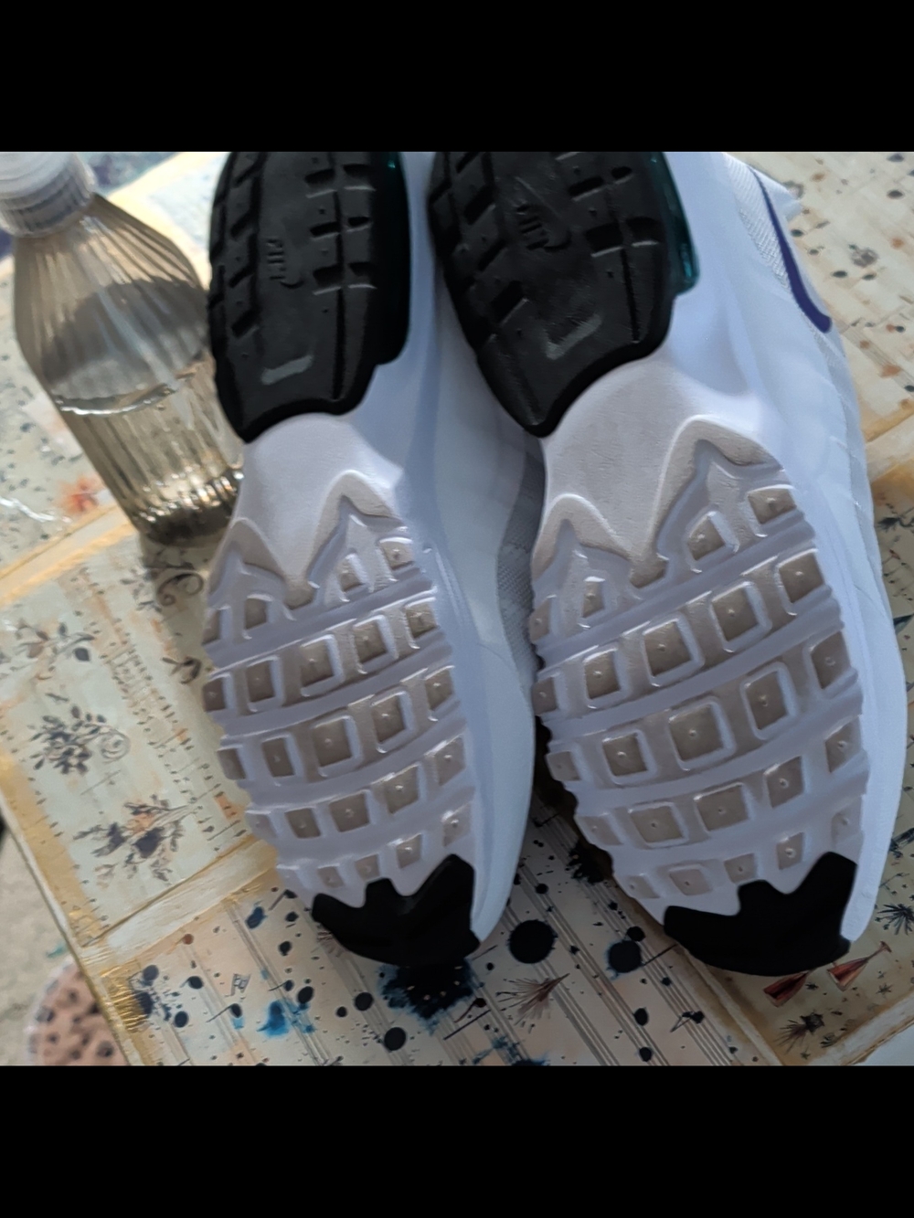 Nike White and Black Athletic Shoes with Purple Swoosh